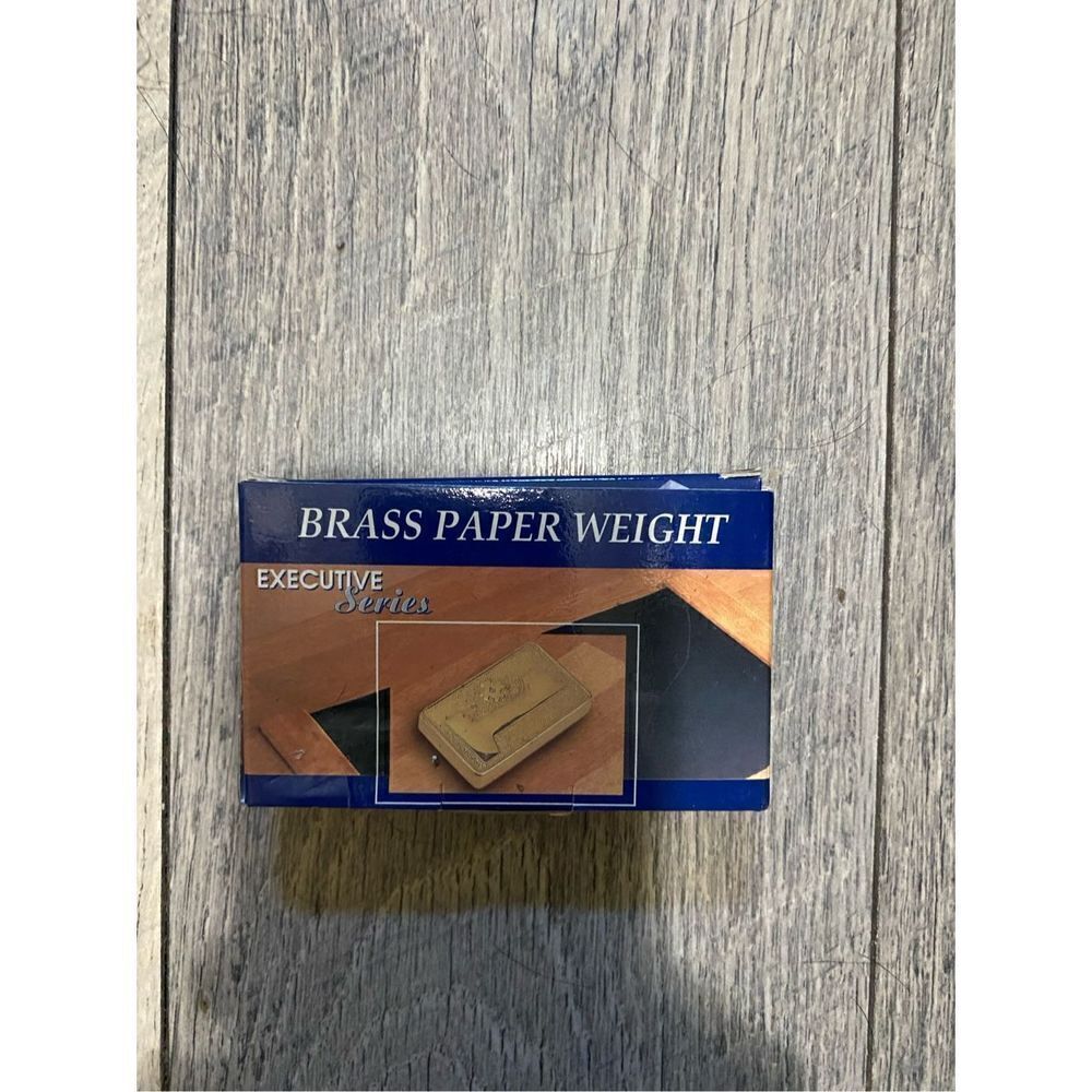 1999 brass paper weight